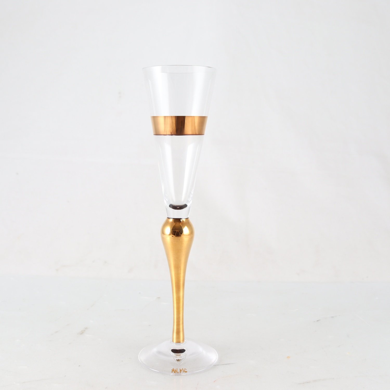 Champagneglas, Orrefors, ’clown gold’ Anne Nilsson. Samfraktas ej.